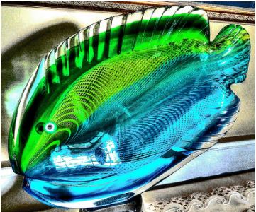 Green and blue glass dish shaped like a fish